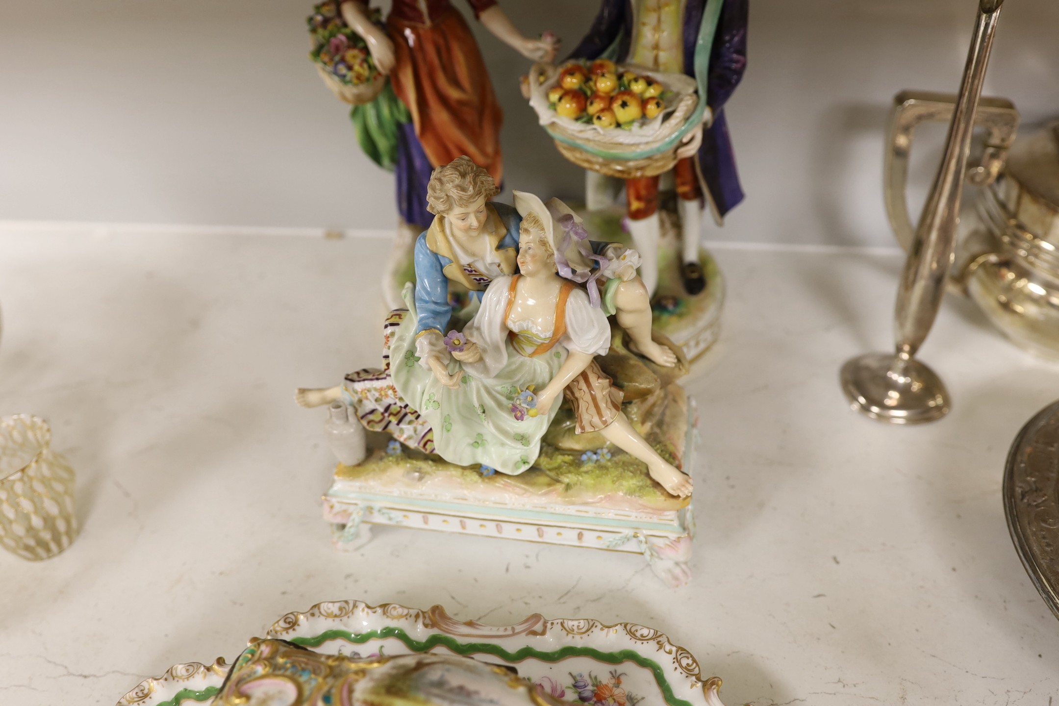 A French figure group, a German figure group, two other items. Tallest 26.5cm